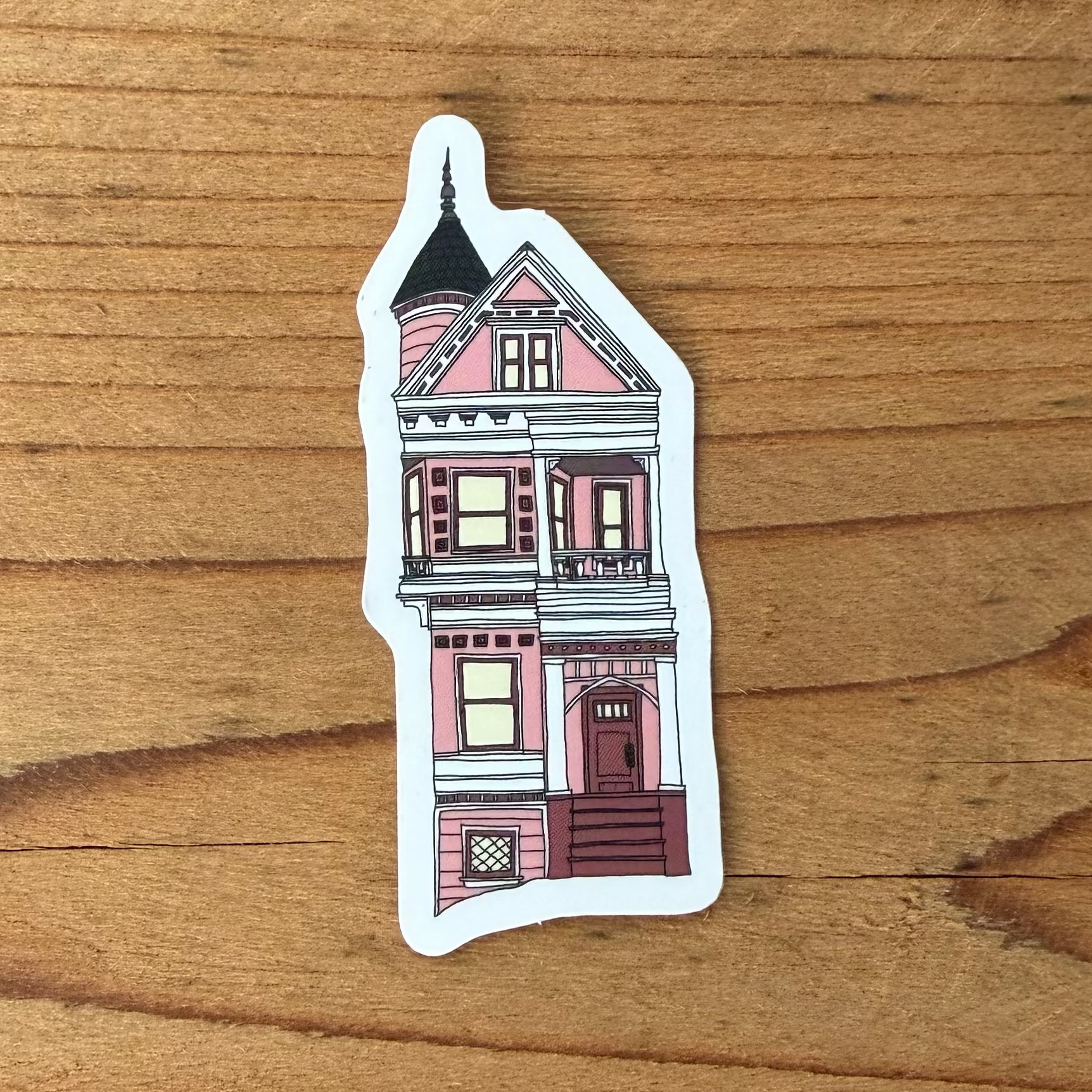 Sticker of a two-story pink victorian house